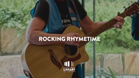 close-up of person playing guitar